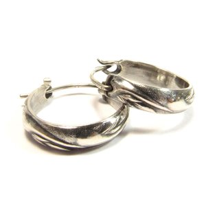 Small swirling pattern sterling silver hoops with secure friction clasp. .75 inches wide and tall. Classic design, oxidized for depth and to show pattern.