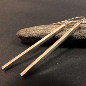 Long, sleek and modern argentium sterling silver bar earrings. bright finish, 2.25 inches long and very lightweight. Great for anytime wear casual or dressy.