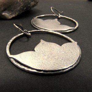 New lotus earring for those that love large earrings. Argentium sterling silver these swing freely for lovely movement.Hammered ring and sand texture lotus provide contrast, interest. Statement earrings, lightweight.2 inch tall  1.5 wide