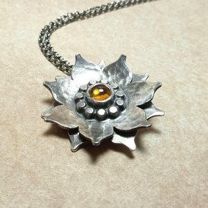 Double-layered Argentium silver lotus pendant with honey citrine cabochon and hammered texture, handmade by Mocahete.