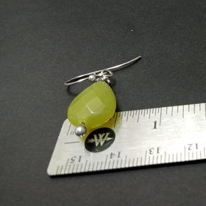 To show width these serpentine and silver dangle earrings photographed against ruler.