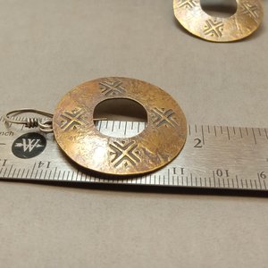 Mixed metal ancient coin style earrings against ruler to show size.