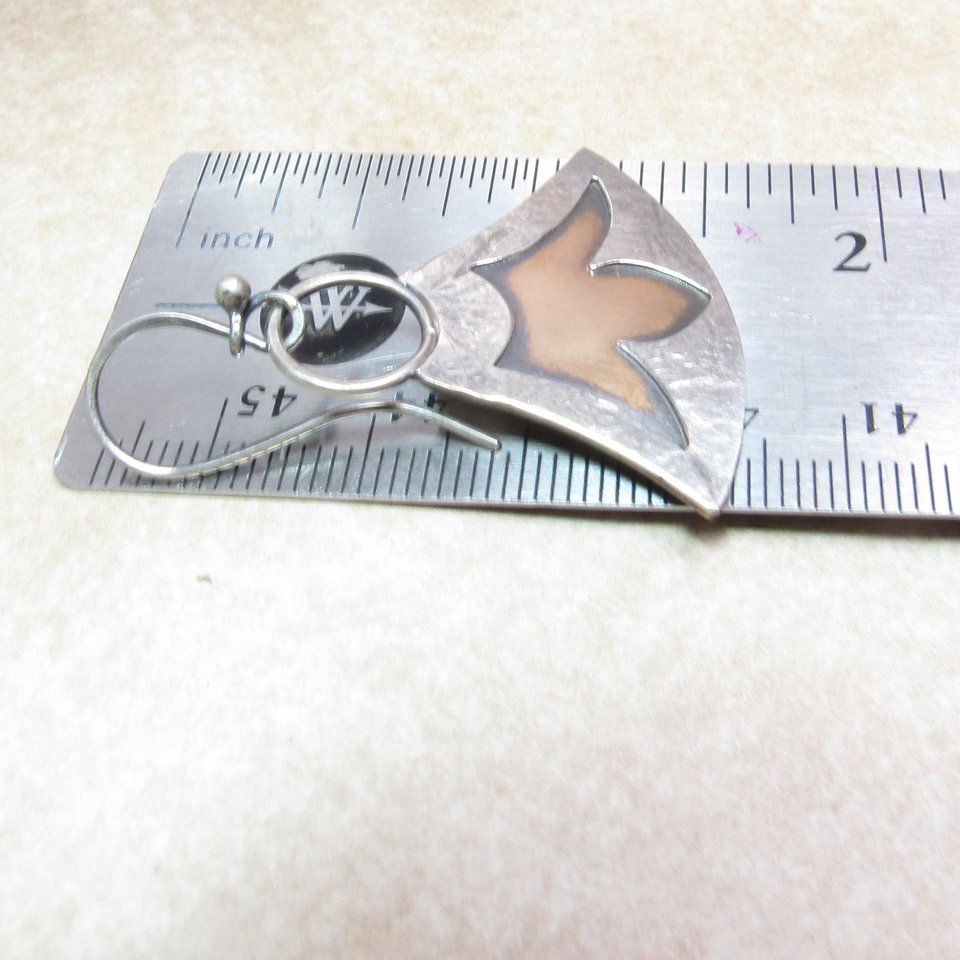 Mixed metal lotus earrings displayed against ruler to show length at apx. 1.5" long.