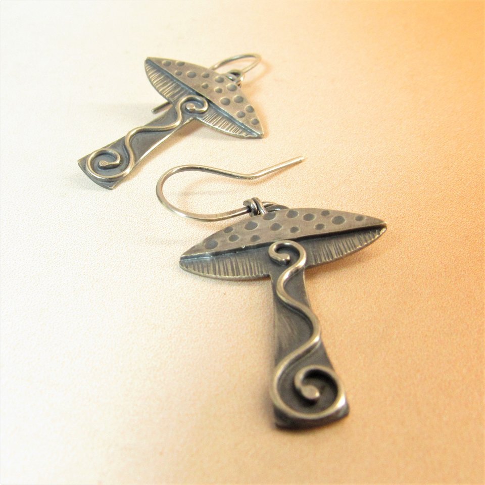 Lovely mushroom earrings in argentium sterling silver, details add up to make these a visual treat. Lightweight, comfortable, fun to wear, a great gift for nature lovers, Oxidized,  polished, 1.75 inch tall, Mushroom cap measures .75 inch wide