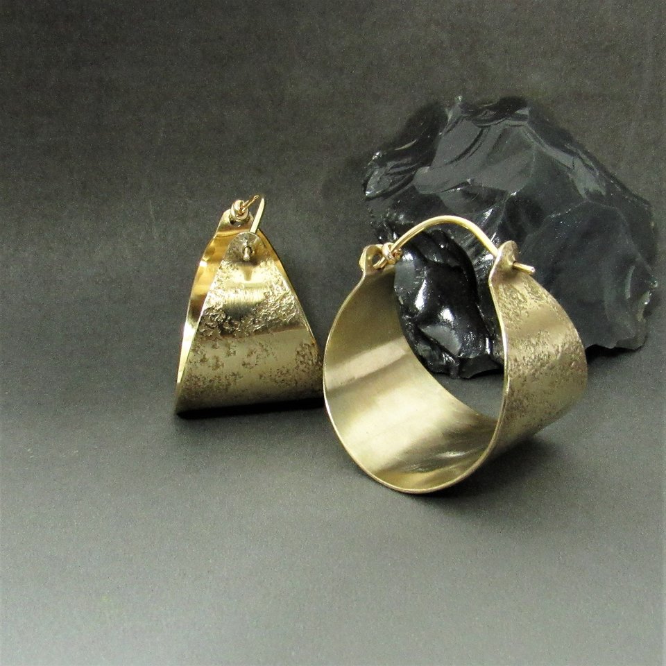 basket style hoop earrings in textured bronze with gold fill ear wires.  the color of these hoops resemble antique gold remarkably. 19 gauge ear wires oxidized and polished to a gleam.1 and 1/8 inch tall x 1 inch wide. Lightweight only 4 grams
