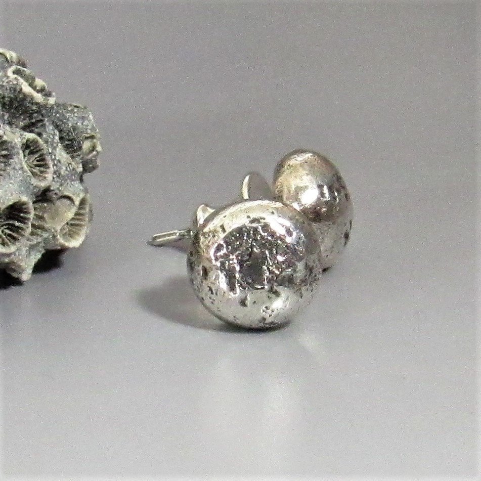 Lovely simplicity, rustic textured silver nugget stud earrings with oxidized finish. Chunky little nuggets make a great everyday pair for men or women. Wear with anything. Complete with post backs to hold them securely.Apx ¼ inch diameter.