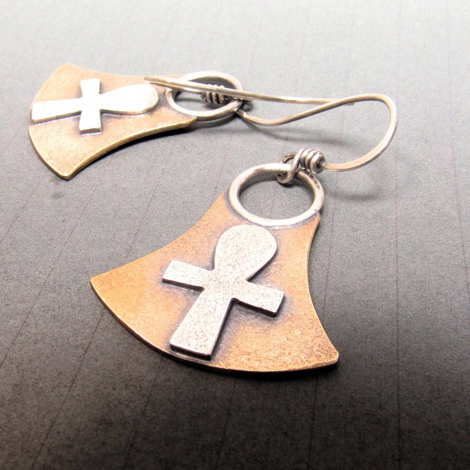 Bronze and sterling silver ankh earrings inspired by Ancient Egypt. Mixed metal design with SS ankh in center of bronze ax shaped drop. Dangle style with ear wires for swingy movement, SS ear wires, 1.5 inches tall x 1 inch wide at widest point.