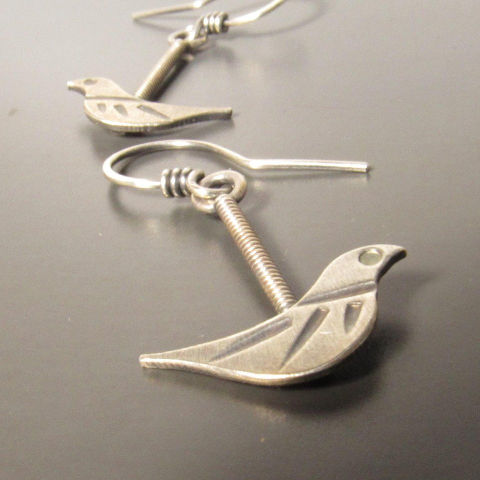 Sweet little everyday bird earrings crafted from 100 percent argentium sterling silver. Lightweight and beautiful details make for a great gift for the bird lover.almost 1.5 inches long and .75 inch at widest point.