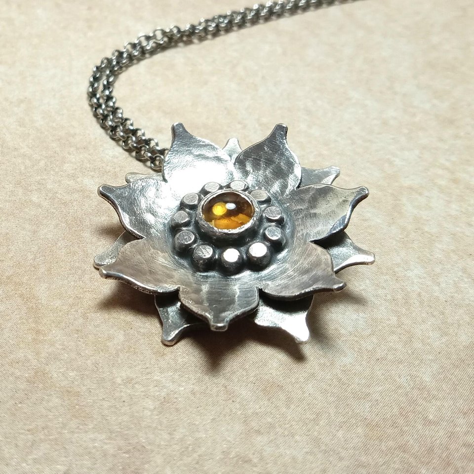 Double-layered Argentium silver lotus pendant with honey citrine cabochon and hammered texture, handmade by Mocahete.