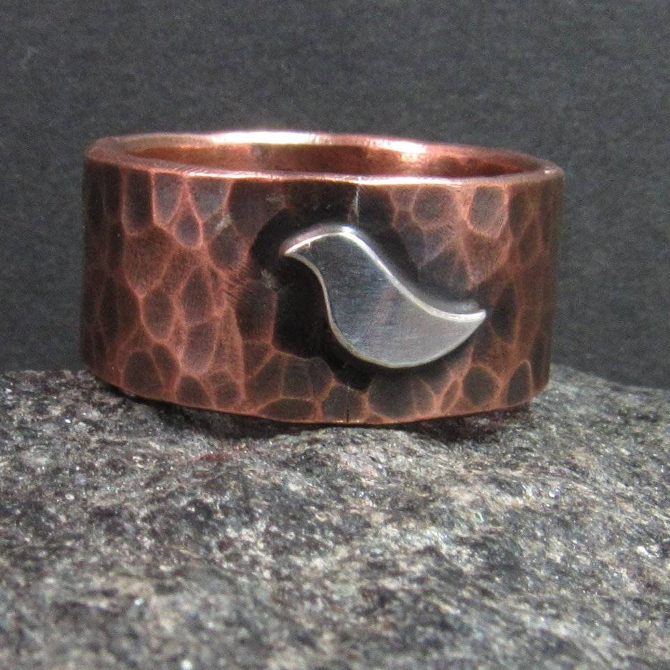 Hammered copper band ring with silver bird, unisex design.